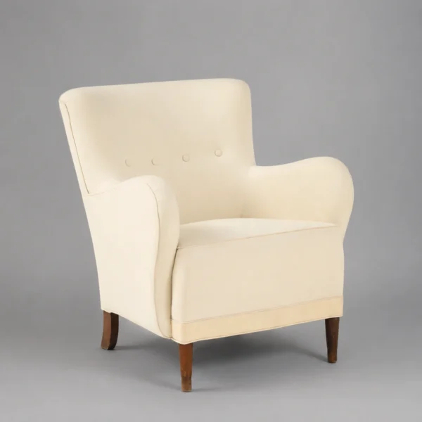 elegant_cream_upholstered_armchair_with_tufting