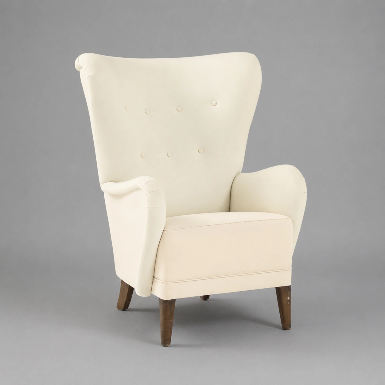 elegant_modern_wingback_armchair_on_gray
