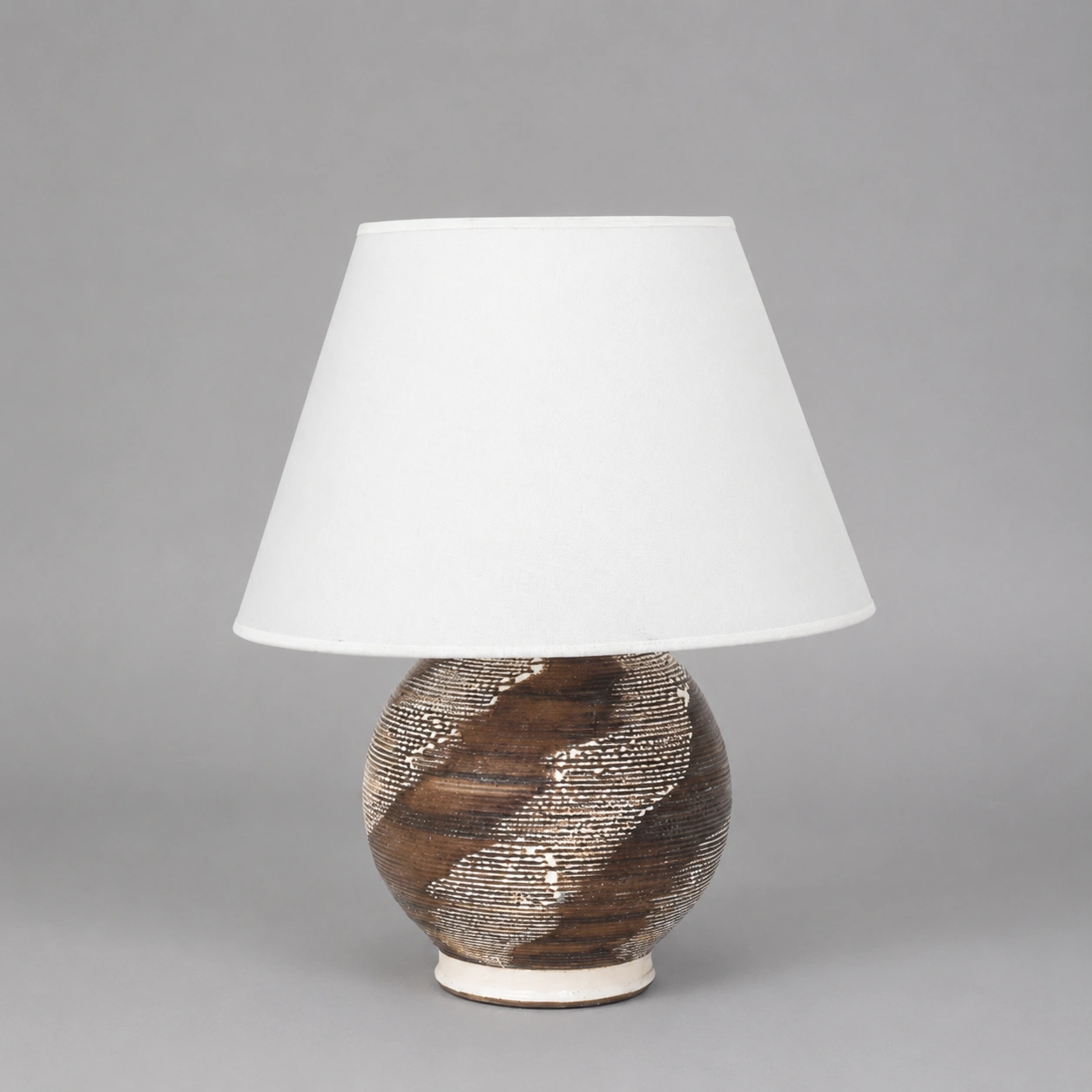 minimalist_table_lamp_on_gray_backdrop