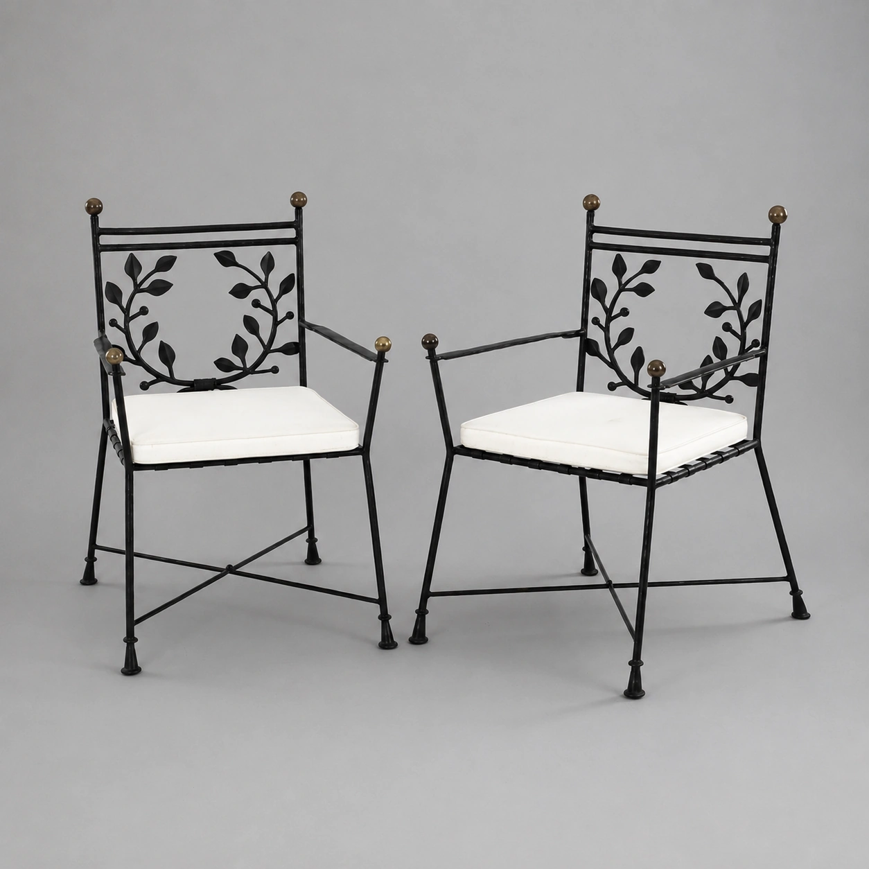 symmetrical_wrought_iron_chairs_with_leaf_designs