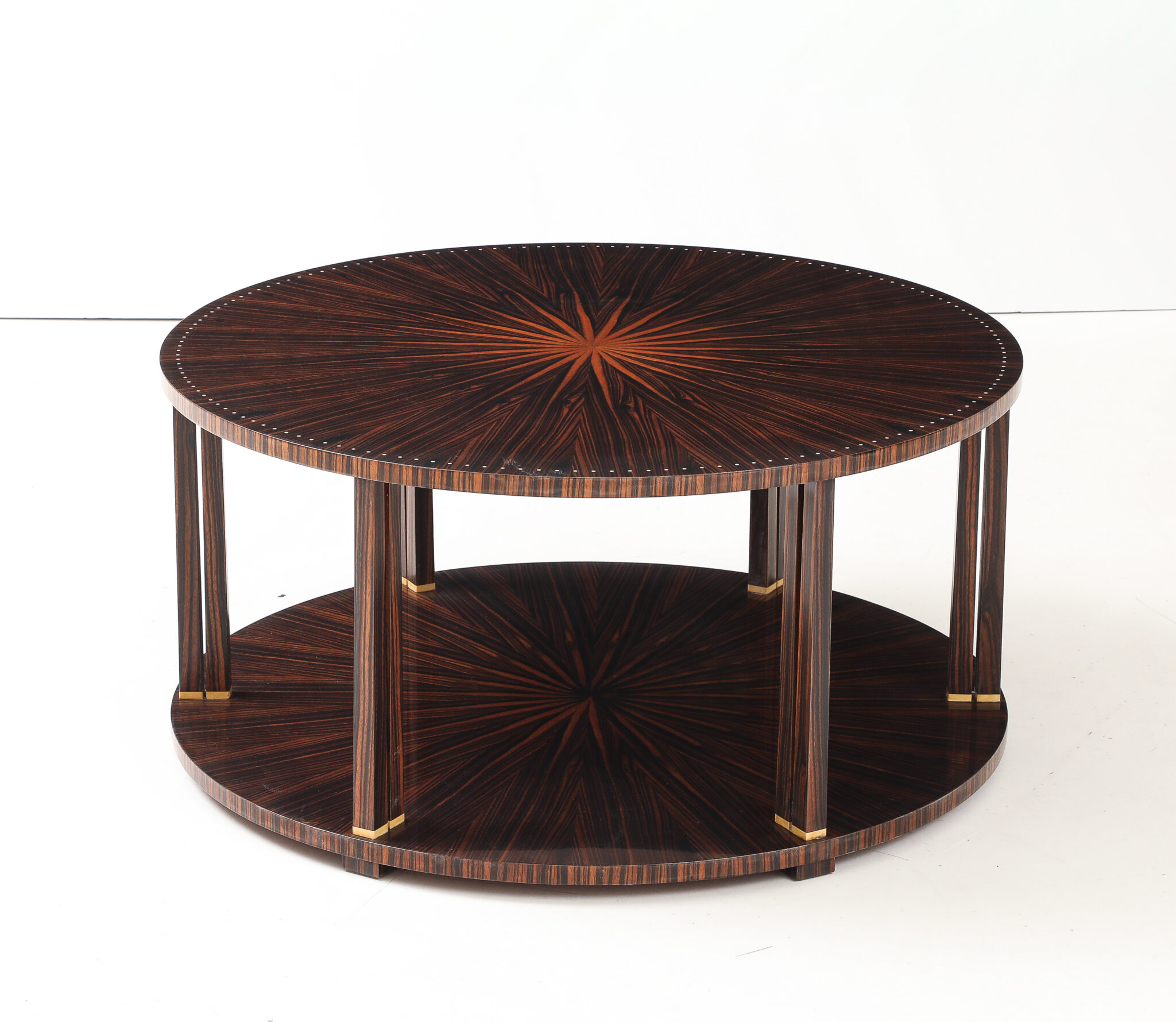 Macassar & Ebony Circular Double Sunburst Coffee Table with Lower Shelf, Inlaid Perimeter Bakelite Details in the style of Jules Leleu, France, signed “Krass' Six Leg Double Column Bakelite Supports, Inset Cube